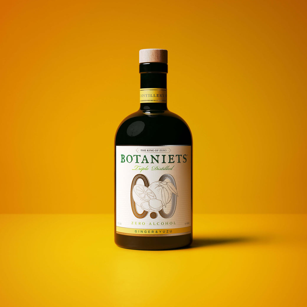 BOTANIETS GINGER & YUZU non alcoholic ginger yuzu botanical spirit bottle on yellow background